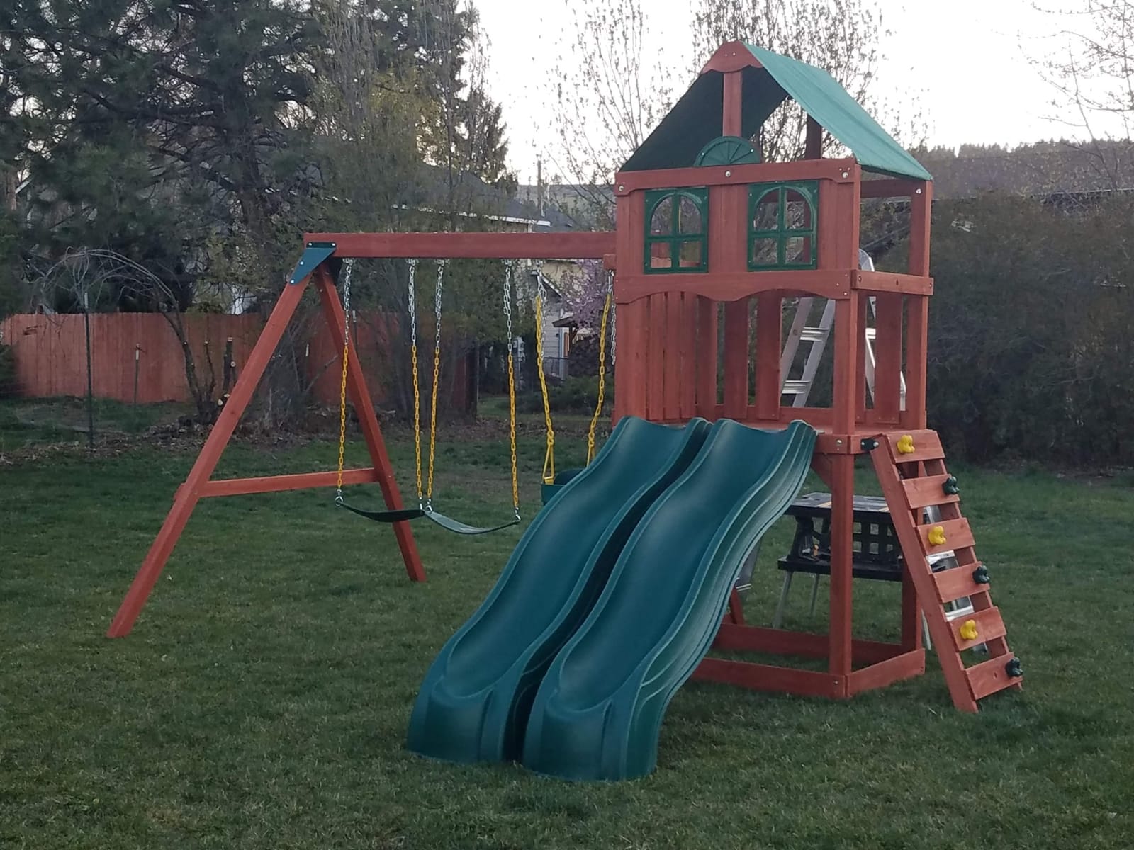 Gorilla Playsets Playmaker Deluxe Wooden Swing Set with Vinyl Canopy Roof, Dual Wave Slides, and Rock Climbing Wall, Redwood Stained Cedar customer photo 2